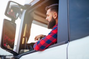 Man using mirrors to park in a spot when driving a big truck after acquiring Rental Trucks Reservation Hammond